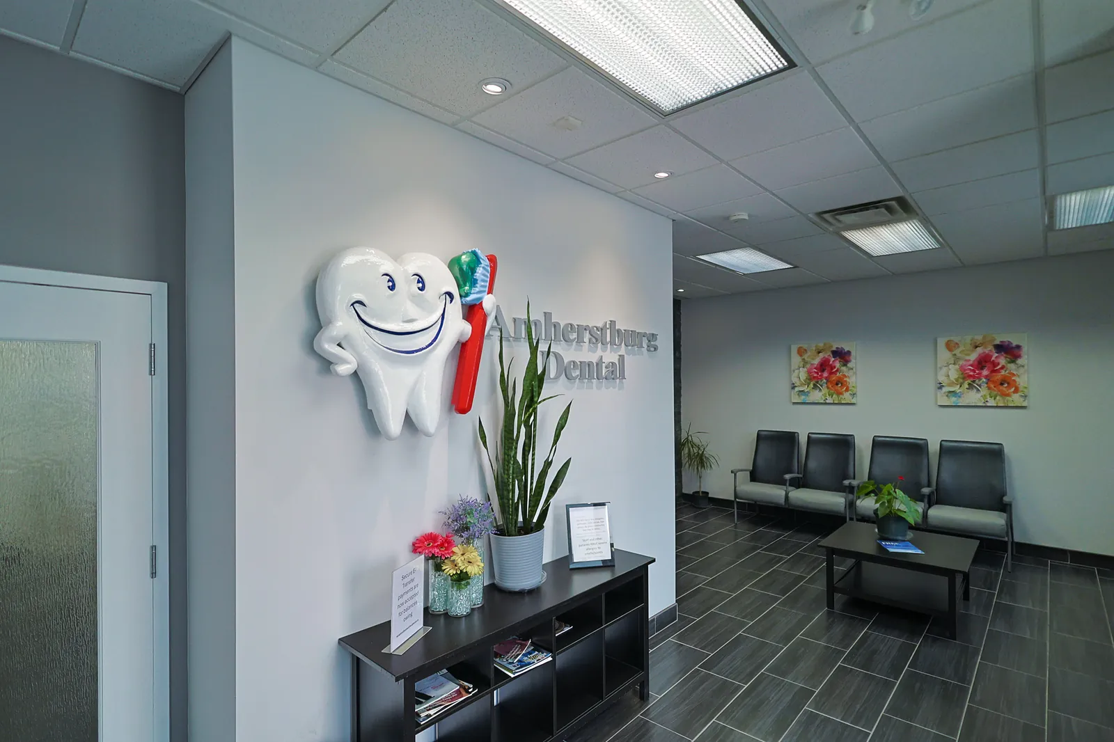 The Amherstburg Dental logo wall and waiting area inside the clinic