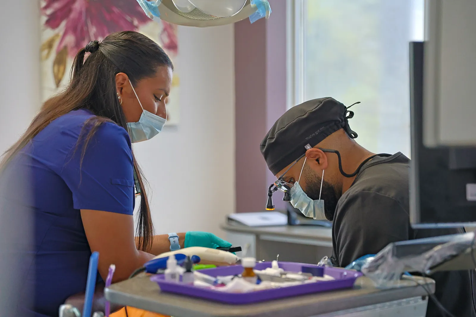 A dentist and assistant providing treatment at Amherstburg Dental